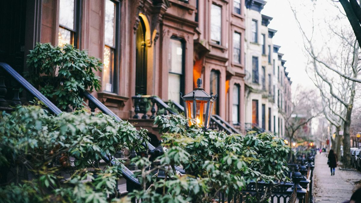 Row of Brooklyn brownstone homes on a residential street